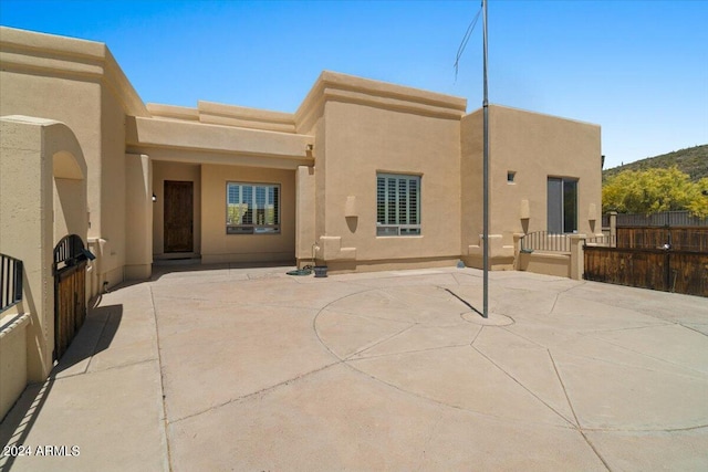 rear view of property with a patio area