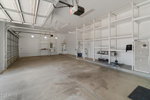 garage with a garage door opener and electric water heater