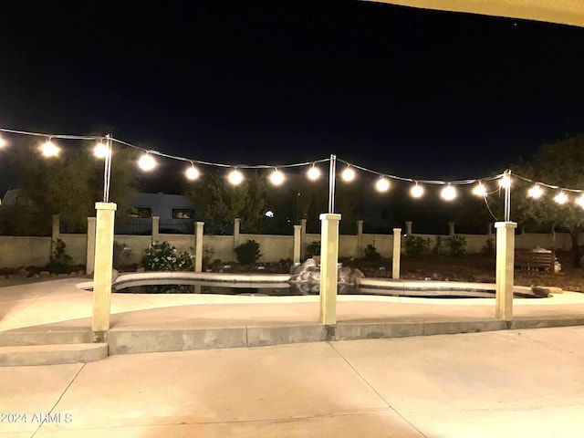 view of patio terrace at night