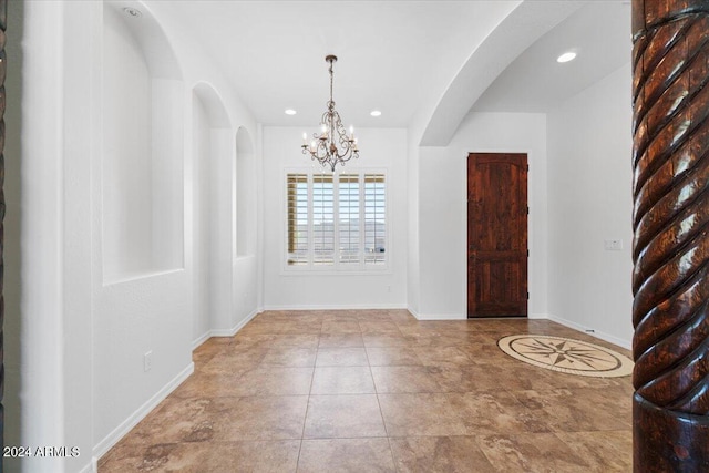 interior space featuring an inviting chandelier