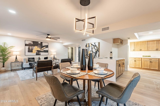 dining area featuring ceiling fan and light hardwood / wood-style floors