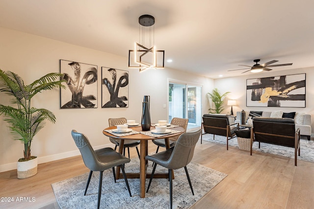 dining room featuring ceiling fan and light hardwood / wood-style floors