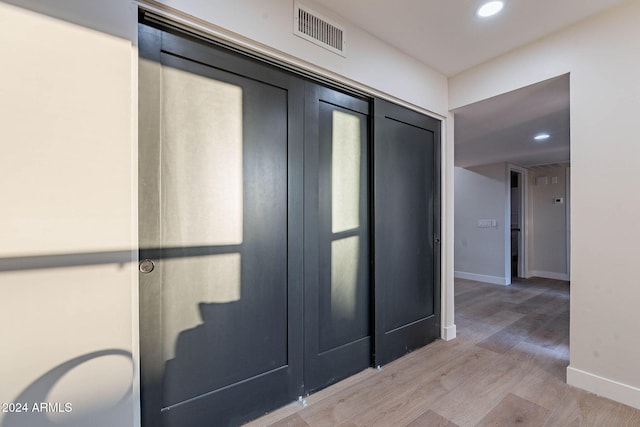 hallway featuring hardwood / wood-style floors