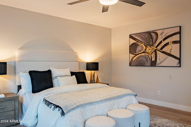 bedroom with wood-type flooring and ceiling fan