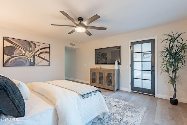 bedroom featuring ceiling fan and light hardwood / wood-style floors