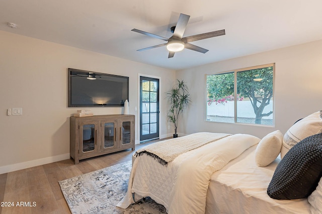 bedroom with ceiling fan and light wood-type flooring