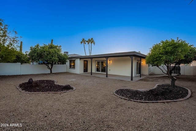 rear view of house featuring a patio