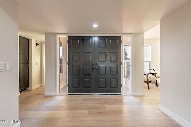 foyer with light hardwood / wood-style floors