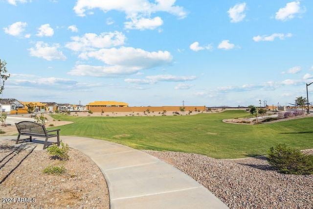 view of home's community with a yard