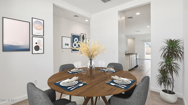 dining space with light tile patterned flooring