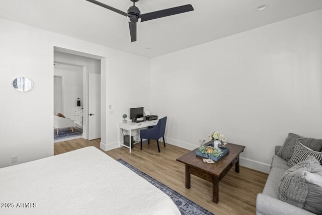 bedroom featuring ceiling fan and hardwood / wood-style flooring