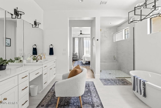 bathroom with ceiling fan, vanity, and separate shower and tub