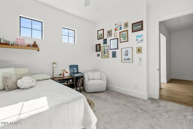 bedroom featuring ceiling fan and light colored carpet