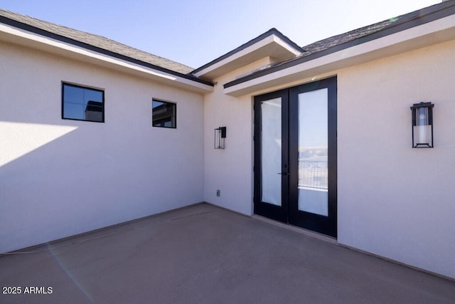 view of patio featuring french doors