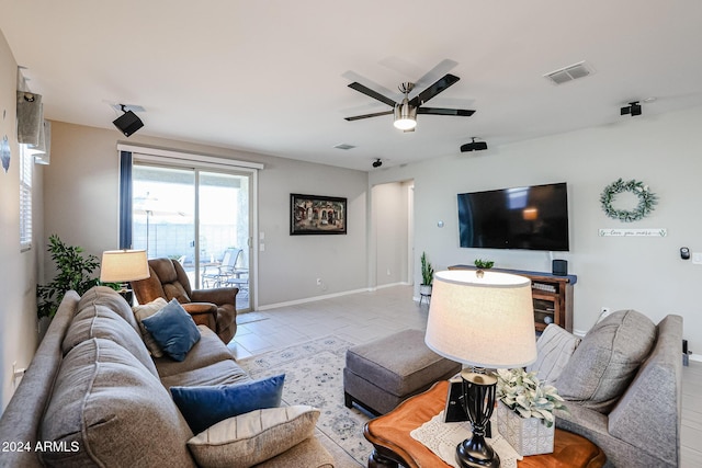 tiled living room featuring ceiling fan