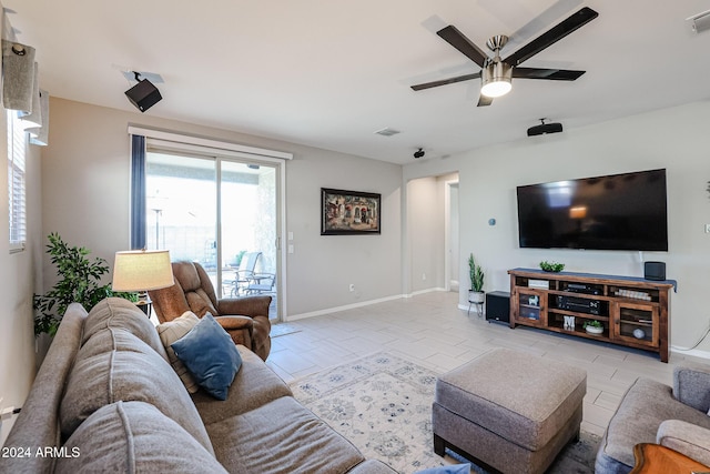 tiled living room featuring ceiling fan