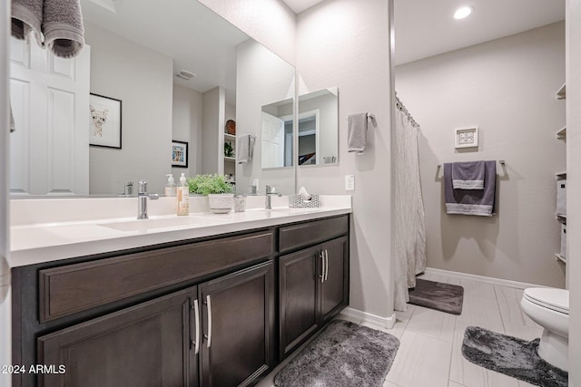 bathroom featuring tile patterned flooring, vanity, toilet, and a shower with shower curtain