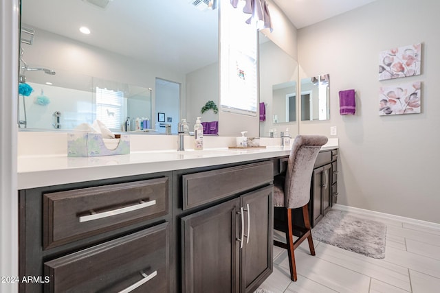 bathroom with vanity and walk in shower