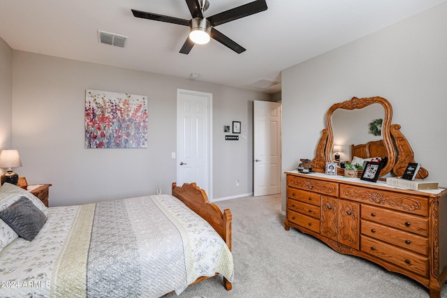 bedroom featuring ceiling fan and light carpet