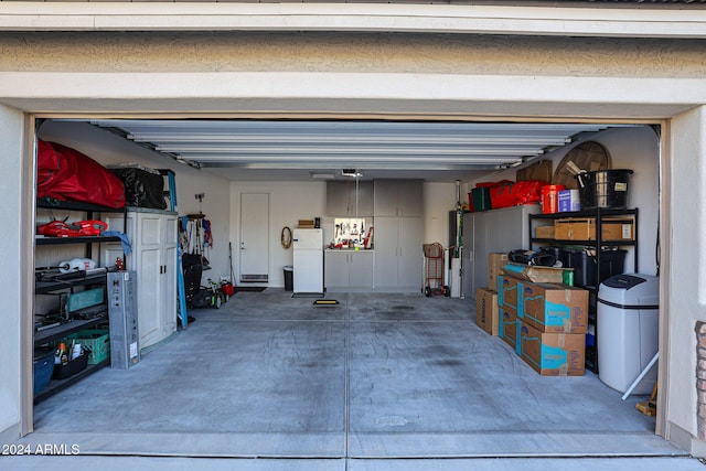 garage featuring white fridge