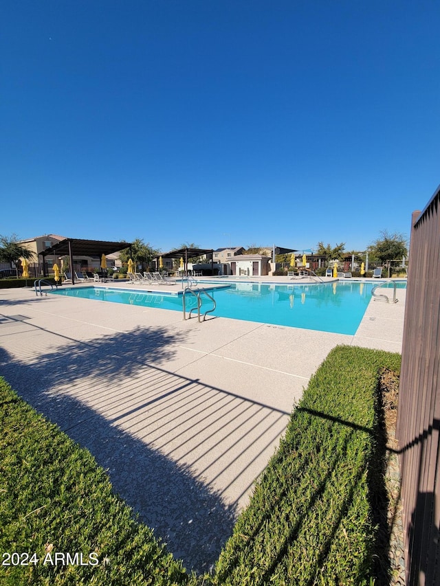 view of swimming pool featuring a patio area