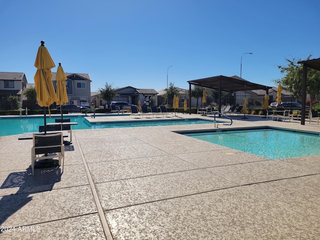 view of swimming pool with a patio area