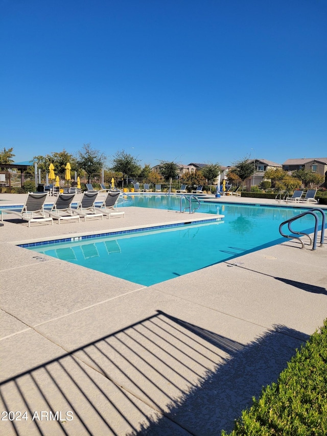 view of swimming pool featuring a patio