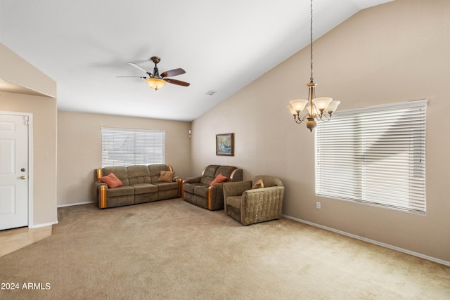 living room featuring light carpet, ceiling fan with notable chandelier, and vaulted ceiling