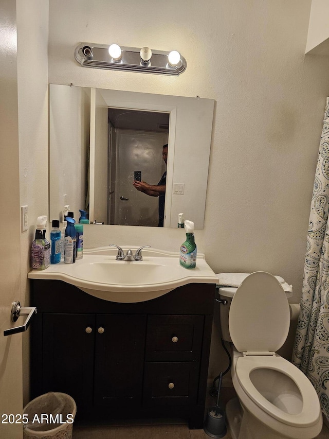 full bath featuring toilet and vanity
