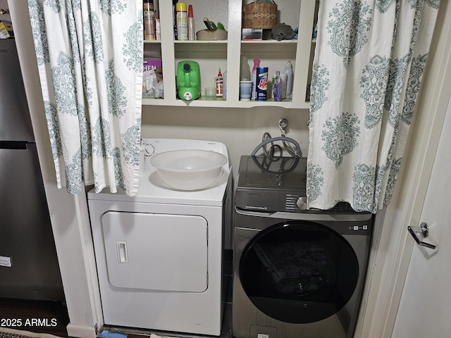 laundry area with independent washer and dryer and laundry area