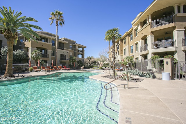 7601 E Indian Bend Rd Unit 1040, Scottsdale, AZ 85250 - community pool featuring a patio area and ceiling fan