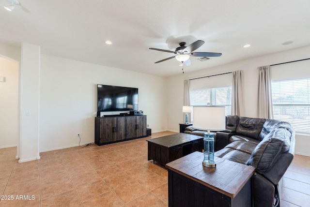 9998 W Prospector Dr, Queen Creek, AZ 85144 - living area with a ceiling fan, light tile patterned floors, arched walkways, recessed lighting, and baseboards