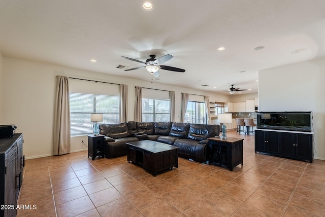 9998 W Prospector Dr, Queen Creek, AZ 85144 - living room with ceiling fan, light tile patterned floors, recessed lighting, and baseboards