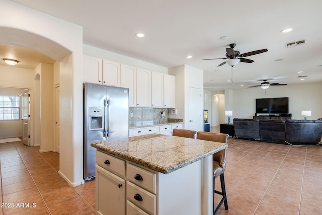 9998 W Prospector Dr, Queen Creek, AZ 85144 - kitchen featuring stainless steel fridge, arched walkways, a ceiling fan, light tile patterned floors, and recessed lighting