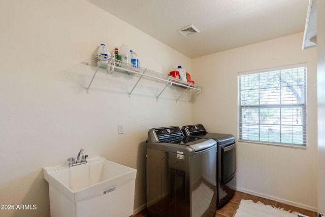 9998 W Prospector Dr, Queen Creek, AZ 85144 - clothes washing area with separate washer and dryer, tile patterned flooring, and baseboards