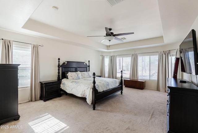 9998 W Prospector Dr, Queen Creek, AZ 85144 - bedroom with a tray ceiling, light colored carpet, and ceiling fan