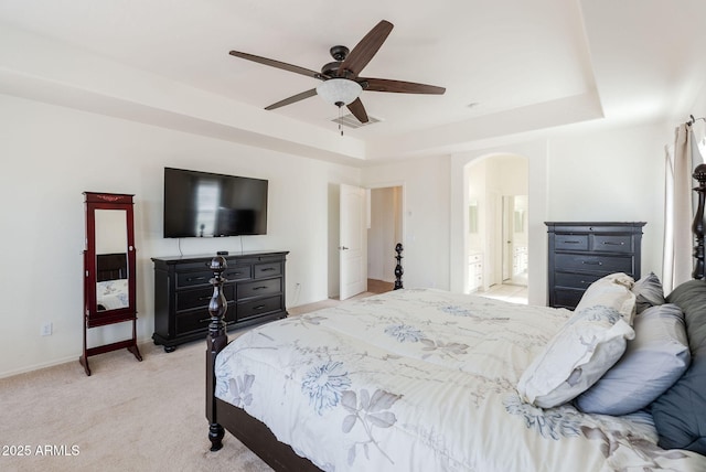 9998 W Prospector Dr, Queen Creek, AZ 85144 - bedroom with arched walkways, a raised ceiling, light colored carpet, baseboards, and a ceiling fan