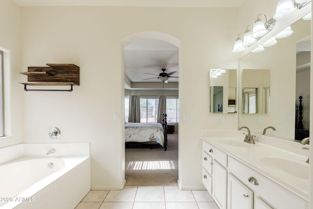 9998 W Prospector Dr, Queen Creek, AZ 85144 - full bath featuring ensuite bath, a ceiling fan, tile patterned flooring, double vanity, and a bath