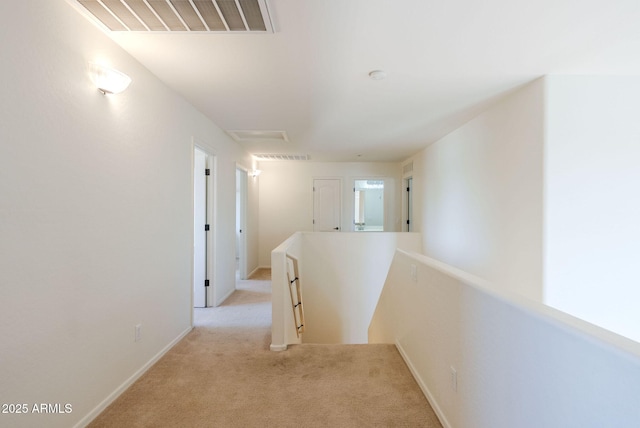 9998 W Prospector Dr, Queen Creek, AZ 85144 - hall with an upstairs landing, attic access, light carpet, and baseboards