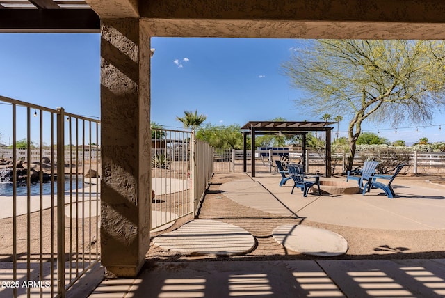 9998 W Prospector Dr, Queen Creek, AZ 85144 - view of patio / terrace featuring a pergola, fence, and an outdoor fire pit