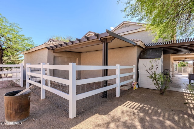 9998 W Prospector Dr, Queen Creek, AZ 85144 - view of property exterior with stucco siding and fence