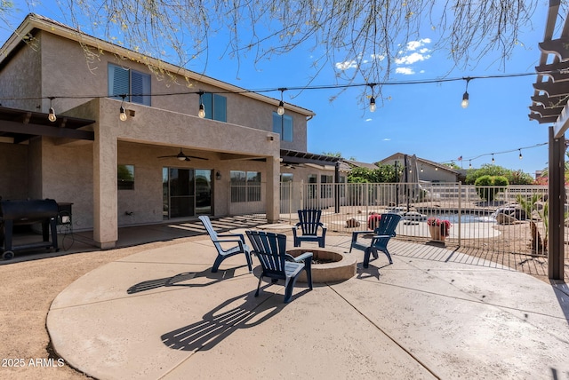 9998 W Prospector Dr, Queen Creek, AZ 85144 - view of patio / terrace with a ceiling fan, fence, and an outdoor fire pit