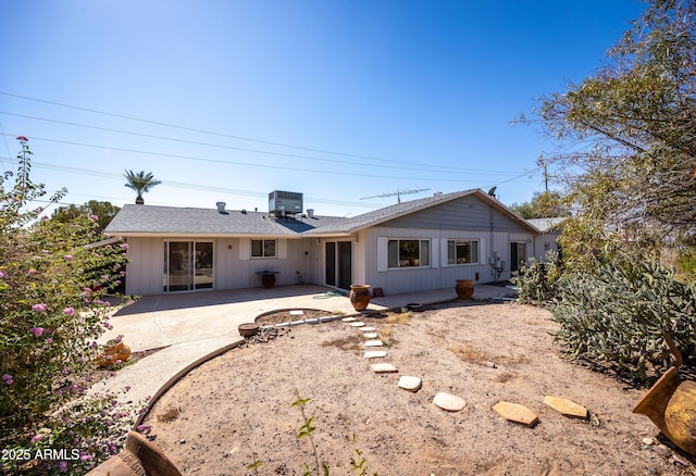 back of house with cooling unit and a patio