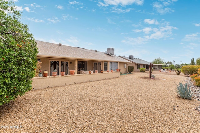 rear view of property featuring a patio