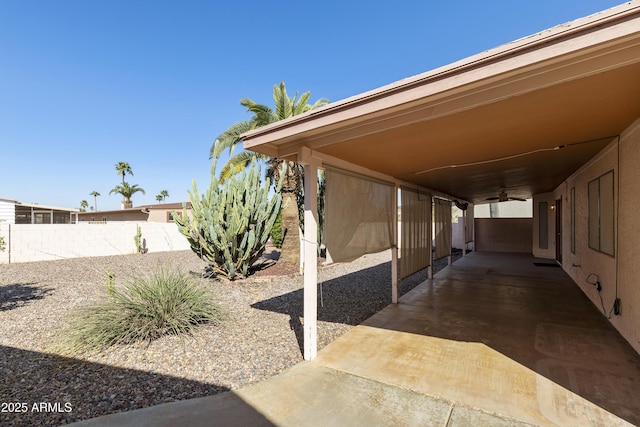 view of patio / terrace featuring fence