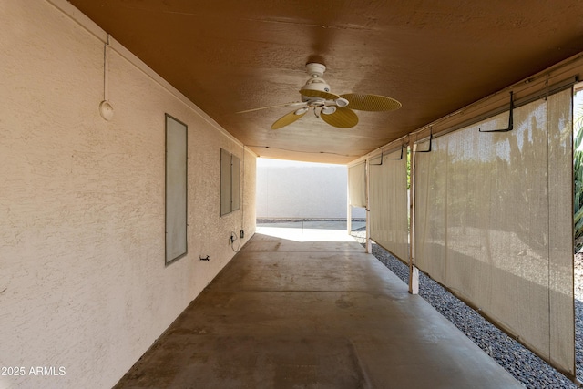 view of patio featuring ceiling fan