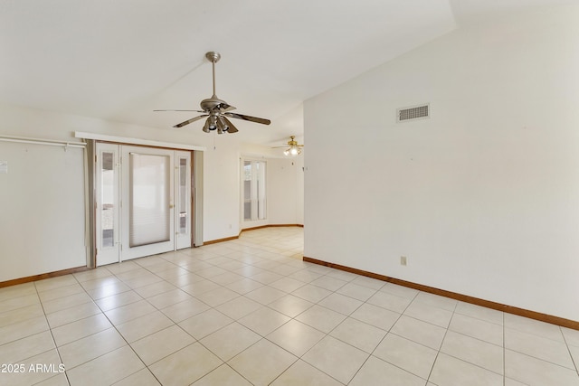unfurnished room with visible vents, baseboards, ceiling fan, vaulted ceiling, and light tile patterned flooring