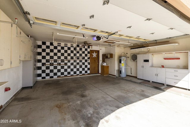 garage with a garage door opener and electric water heater