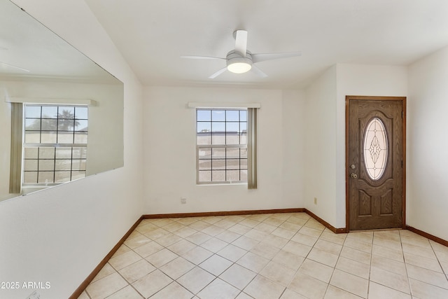 entrance foyer with light tile patterned floors, baseboards, and ceiling fan