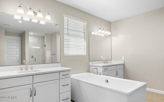 bathroom with vanity, hardwood / wood-style floors, and separate shower and tub